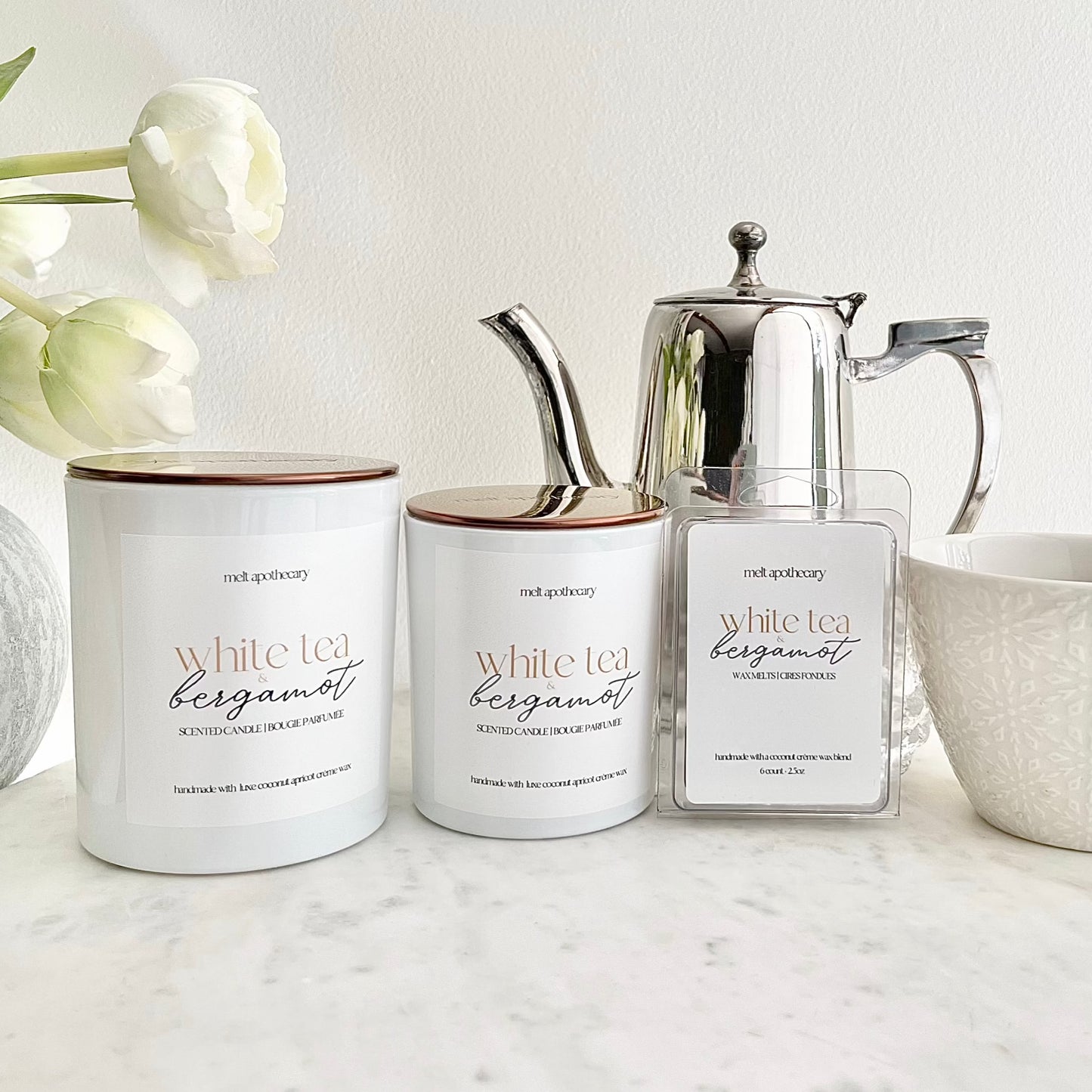 the white tea & bergamot collection including the 12oz candle, 7.5oz candle and wax melts